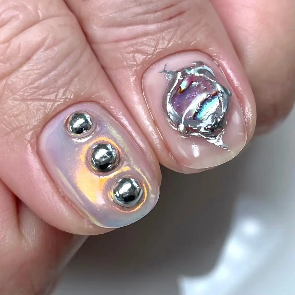 Iridescent aura set with polished silver domes and a chrome charm